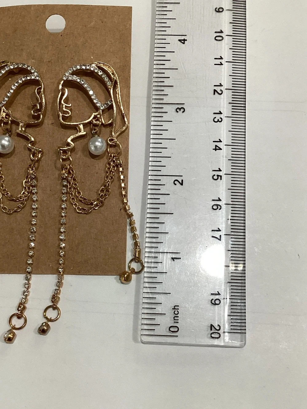 Gold Face Outline Drop Earrings with Pearl and Chain Accents